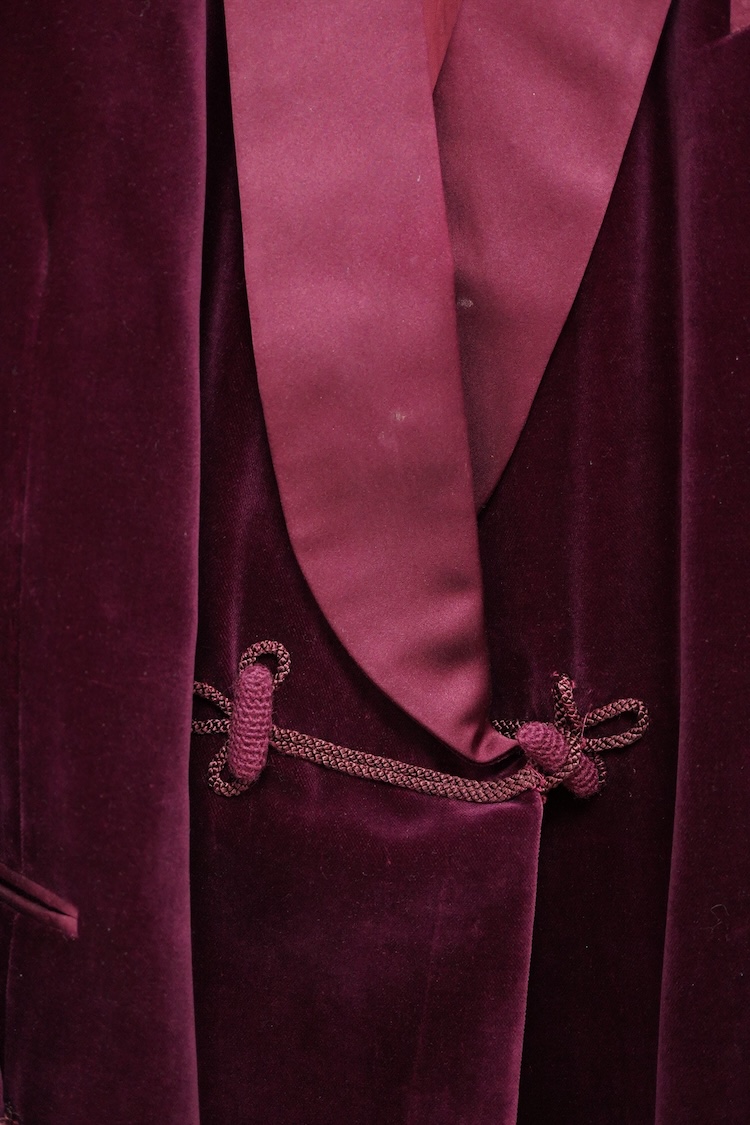 The property of a titled gentleman: A Redwood & Feller maroon velvet mid 20th century gentleman’s smoking jacket, with maroon silk cuff and collar detail, front chest 56cm.
